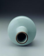 Paper mallet-shaped vase with feng-hua inscription in light bluish-green glaze