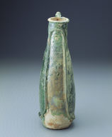 Green-glazed ewer in the shape of a leather pouch