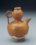 Yellow-glazed pitcher in the shape of a gourd