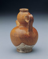 Yellow-glazed pitcher in the shape of a gourd