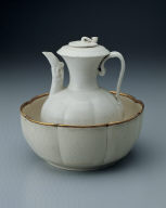 Pitcher with white glaze and dragon spout. Warming bowl with incised floral design in white glaze, Ding ware