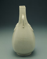 Squarish ewer with applied mask and dragon shaped handles in white glaze