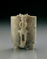 Jade adjacent cup. Imitation of Han bronze. Carving of eagle and bear used as a pun on the words Ying (falcon) and Xiong (bear)