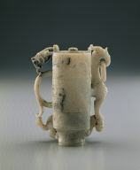 Jade adjacent cup. Imitation of Han bronze. Carving of eagle and bear used as a pun on the words Ying (falcon) and Xiong (bear)