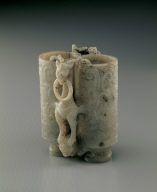 Jade adjacent cup. Imitation of Han bronze. Carving of eagle and bear used as a pun on the words Ying (falcon) and Xiong (bear)