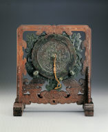 Wood stand with jade plague