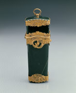 Green stone box contains pencil, scissor, etc.