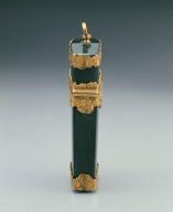 Green stone box contains pencil, scissor, etc.