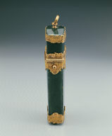 Green stone box contains pencil, scissor, etc.