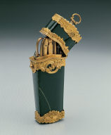 Green stone box contains pencil, scissor, etc.