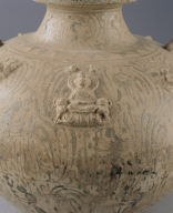 Covered jar in celadon glaze with underglaze painting of winged figure