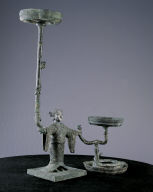 Bronze lamp with support of silver-headed human figure