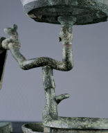 Bronze lamp with support of silver-headed human figure