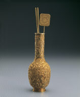 Gold vase, chopsticks, and shovel