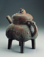 Bronze He vessel with interlacing dragon motif