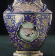 Revoloving-center vase with fish decor in cobalt blue with gold tracery