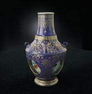 Revoloving-center vase with fish decor in cobalt blue with gold tracery
