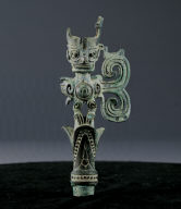 Bronze branch finial in the shape of bird with human head