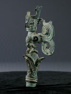 Bronze branch finial in the shape of bird with human head