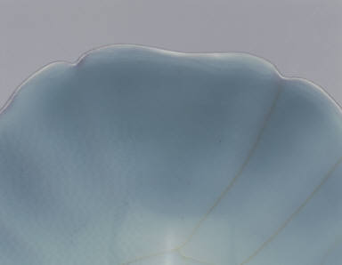 Hibiscus-shaped bowl with light bluish-green glaze