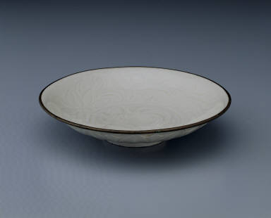 Dish with carved lotus petals and incised decor in white glaze