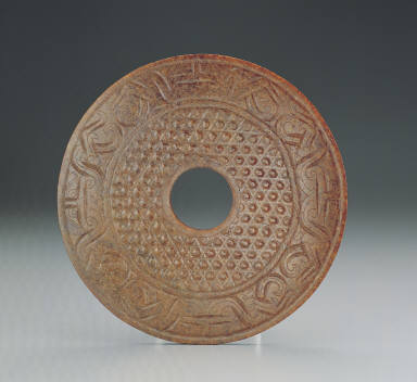 Jade bi disk with twin-bodied animal mask design