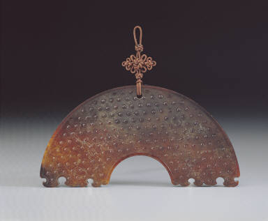 Segmented jade bi disk