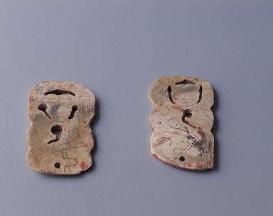 Pair of jade pendant in the form of dancing figure