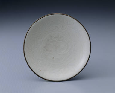 Dish with carved lotus petals and incised decor in white glaze