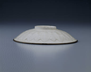 Dish with carved lotus petals and incised decor in white glaze