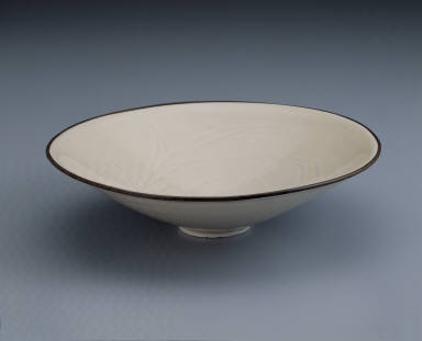 Bowl with incised waterfowl and lotus pond design in white glaze
