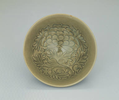 Bowl with incised peony decor in yellowish-green glaze