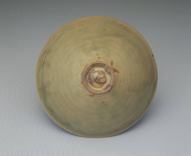 Bowl with incised peony decor in yellowish-green glaze