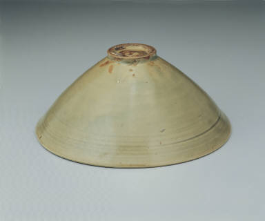 Bowl with incised peony decor in yellowish-green glaze