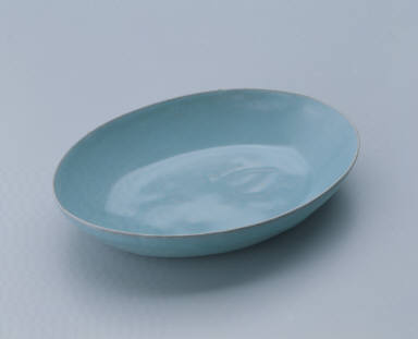 Small oval dish with light bluish-green glaze
