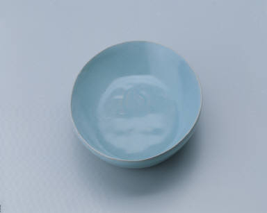 Small oval dish with light bluish-green glaze