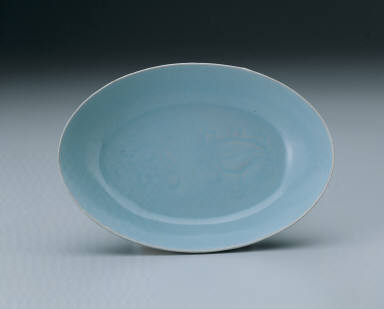 Small oval dish with light bluish-green glaze