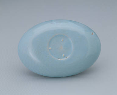 Small oval dish with light bluish-green glaze