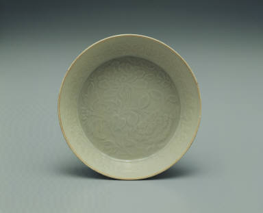 Pale bluish-green glazed bowl with impressed floral design