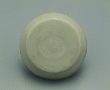 Pale bluish-green glazed bowl with impressed floral design