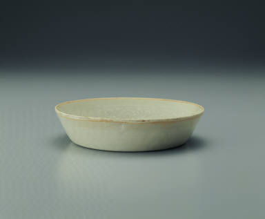 Pale bluish-green glazed bowl with impressed floral design