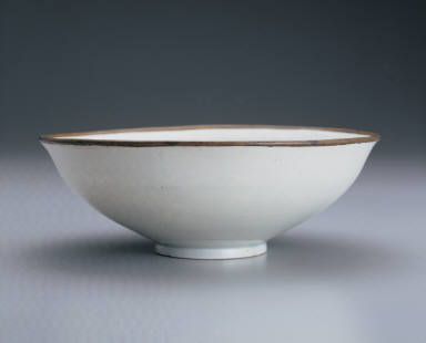 Translucent-blue glazed bowl with impressed double-phoenix design