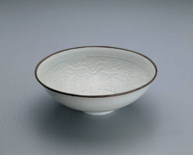 Translucent-blue glazed bowl with impressed double-phoenix design