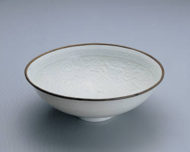 Translucent-blue glazed bowl with impressed double-phoenix design