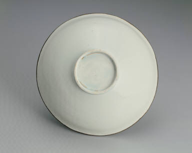 Translucent-blue glazed bowl with impressed double-phoenix design