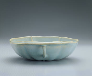 Hibiscus-shaped cup with ear handle in sky-blue glaze