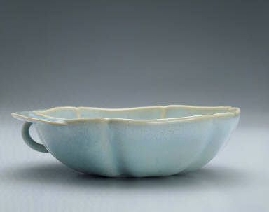 Hibiscus-shaped cup with ear handle in sky-blue glaze