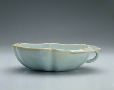 Hibiscus-shaped cup with ear handle in sky-blue glaze