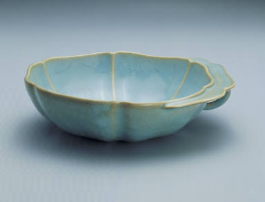Hibiscus-shaped cup with ear handle in sky-blue glaze