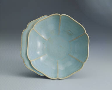 Hibiscus-shaped cup with ear handle in sky-blue glaze